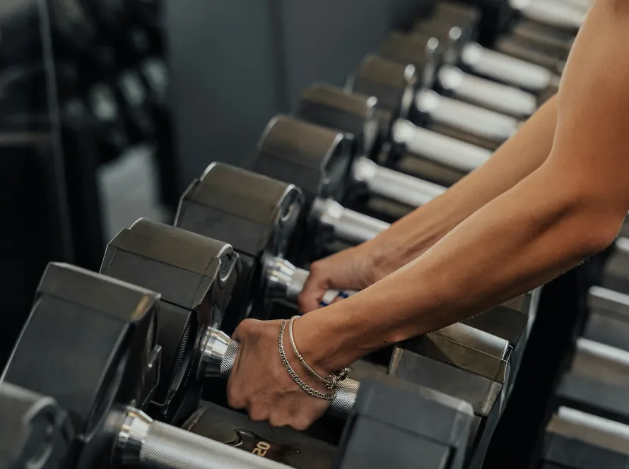Woman strength training representing muscle preservation during GLP-1 weight loss